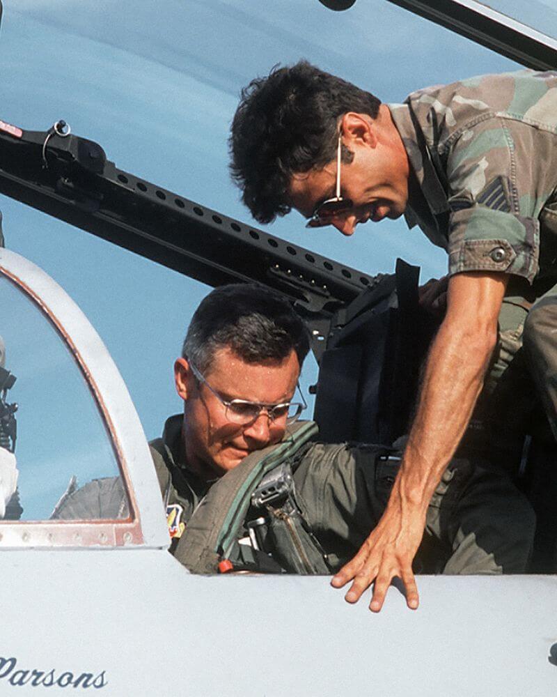 Two pilots wearing Randolph sunglasses in aircraft cockpit